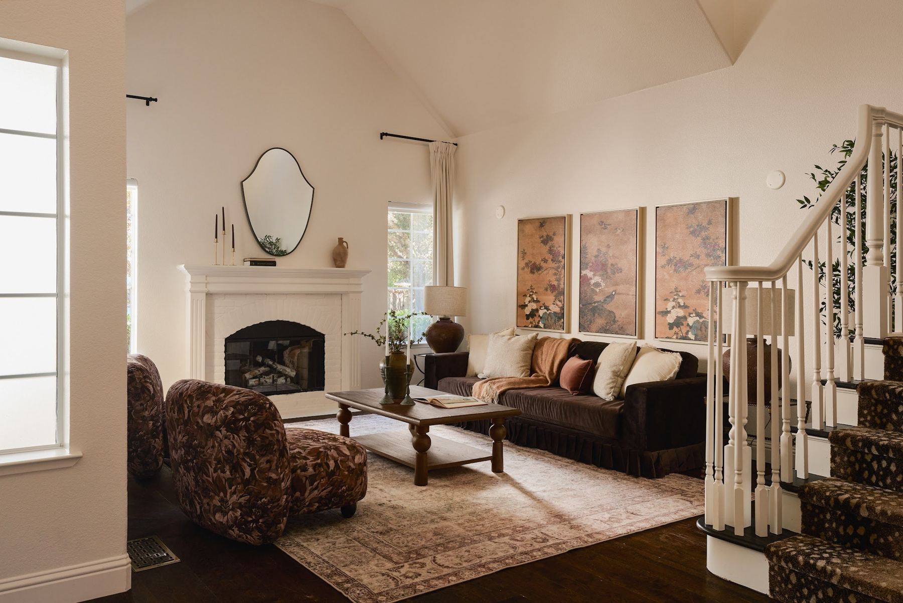 Living room with vaulted ceiling and fireplace at 104 Horgan Ave