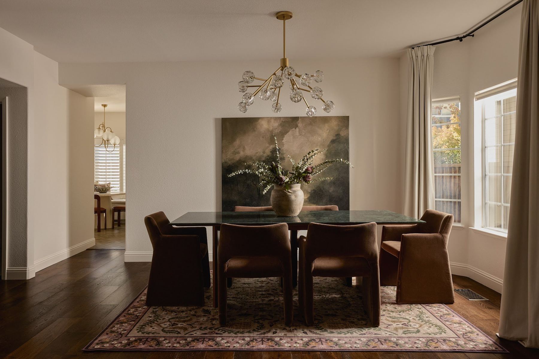 Formal dining room with sculptural chandelier
