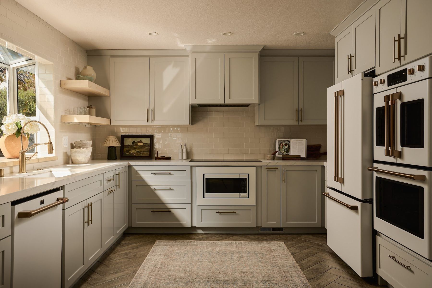 Kitchen with sage cabinetry and open shelving